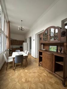 a kitchen and dining room with a table and chairs at Guest House - Tbilisi Center in Tbilisi City