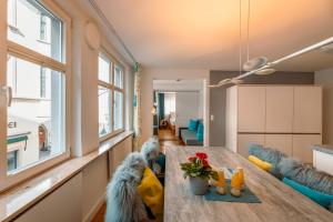 a living room with a table and a couch at Haus Triflinger in Lindau