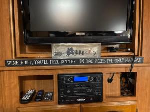a tv sitting on top of a entertainment center at Water Front Tracer RV by Glampers Camp in Port Charlotte