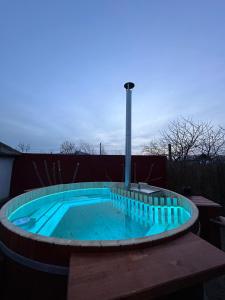 a hot tub with a light on top of it at Casa Pavel Jurilovca in Jurilovca