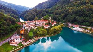 an aerial view of a town next to a river at apartma jermol in Most na Soči