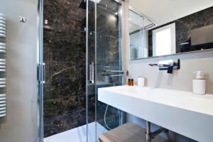a bathroom with a sink and a shower at Chapeau Apartment - Lecce Selection in Squinzano