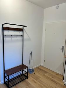 a shelf in a room with a white wall at Adel Kaldekirche in Essen