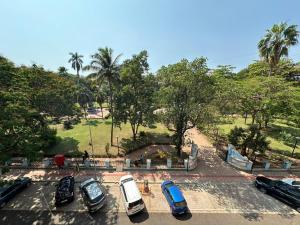 a group of cars parked in a parking lot at HOTEL DADO'S INN in Panaji