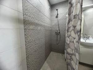 a bathroom with a shower and a sink at Local 3 Puerto Colon First Line The Loft Coworking Suite in Adeje