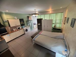 a large room with a bed and a kitchen at Local 3 Puerto Colon First Line The Loft Coworking Suite in Adeje