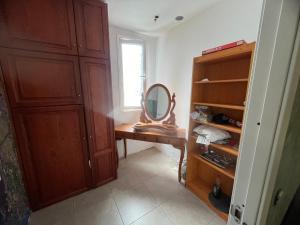 a dressing room with a mirror and a wooden cabinet at Local 3 Puerto Colon First Line The Loft Coworking Suite in Adeje