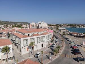 an aerial view of a city street with buildings and cars at Cumbalıca Beach Hotel in Cesme