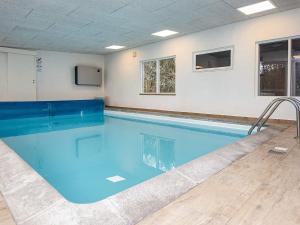 a large swimming pool in a room at 6 person holiday home in Hemmet in Hemmet