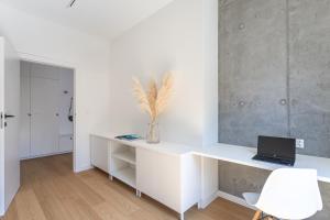 Televízia a/alebo spoločenská miestnosť v ubytovaní S35 Apartments Gdynia Orłowo