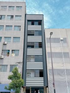 a tall building with a street light in front of it at 【三米通天閣】302-3FB難波商圈天王寺心斎橋10min in Osaka