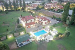 an aerial view of a house with a swimming pool at Podere Venanzio in Lido di Camaiore