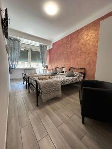 - une chambre avec 2 lits dans l'établissement Capri B&B, à Bolzano
