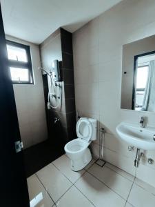 a bathroom with a toilet and a sink at ReHut @ Setia Seraya by AzRaHomes in Putrajaya