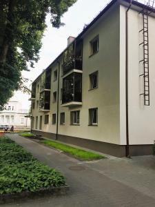 an apartment building with balconies on the side of it at Apartment in the City center in Druskininkai