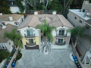 an aerial view of a house with palm trees at Universal studios getaway in Los Angeles