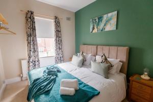 a bedroom with a bed with a mermaid on it at The Green House 3 Bed House - Contractors, Families, Free Parking, close to racecourse and city centre in Doncaster