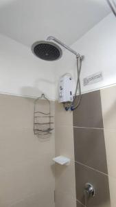 a shower in a bathroom with a shower at C&C Cool View Tagaytay Staycation in Tagaytay