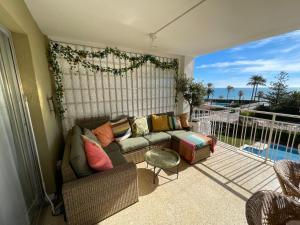 a living room with a couch and a balcony at EPIS - large luxury apartment with sea view in Benicàssim