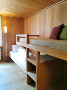 Postel nebo postele na pokoji v ubytování Hotel Alpina
