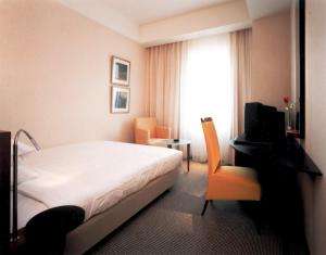Hotel Molino Shin Yuri tesisinde bir odada yatak veya yataklar