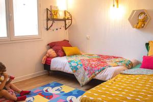 Postel nebo postele na pokoji v ubytování Appartement rez-de-chaussée et terrasse privative