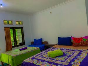 Ένα ή περισσότερα κρεβάτια σε δωμάτιο στο Breeze Hostel