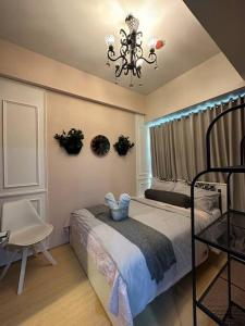 Postel nebo postele na pokoji v ubytování Condo in BGC near Grand Hyatt + 33 fotografií