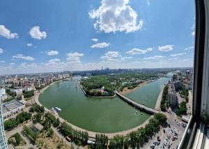 a view of a river from a skyscraper at Grand Alatau in Astana +6 photos