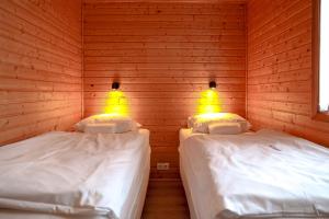 Postel nebo postele na pokoji v ubytování Akureyri Cottages