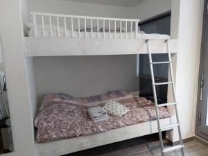 a bunk bed with two pillows on the bottom bunk at Studio 503, La Bresse Hohneck in La Bresse