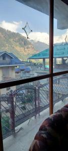 a view of a balcony with a view of a bridge at Hotel Jubilant Manali in Manāli