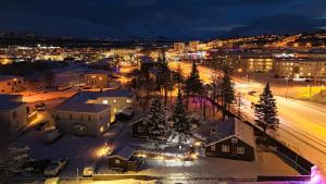 an aerial view of a city at night at Akureyri Cottages in Akureyri