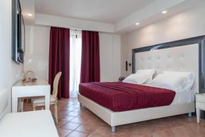 Voodi või voodid majutusasutuse Hotel Martino toas