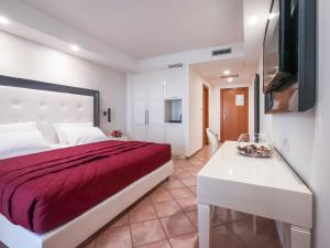 Voodi või voodid majutusasutuse Hotel Martino toas