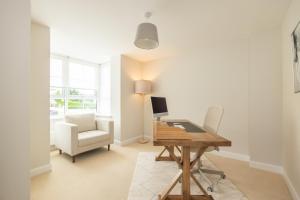a home office with a desk and a chair at Luxury Detached Home in Edinburgh