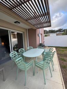 a table and chairs sitting on a patio at Maison Joepolly corsica in Bonifacio