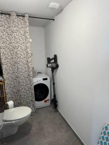 a bathroom with a toilet and a camera in a room at Maison Joepolly corsica in Bonifacio +18 photos