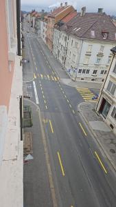 an aerial view of an empty city street with buildings at Standard room in La Chaux-de-Fonds