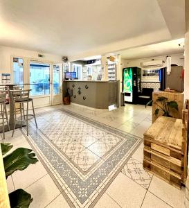 a living room with a map on the floor at Hotel Les Palmiers En Camargue in Saintes-Maries-de-la-Mer