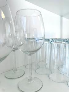 a group of wine glasses sitting on a counter at Stay Westend in Wetzlar