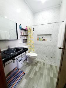 a bathroom with a sink and a toilet at Apartment in Vientiane