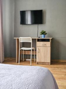 TV a/nebo společenská místnost v ubytování Muzeja apartamenti