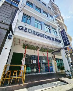 a store front of a building with a sign on it at Georgetown Inn by Sky Hive in George Town