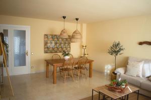 a living room with a table and a couch at Espectacular Casa en La Garriga in La Garriga