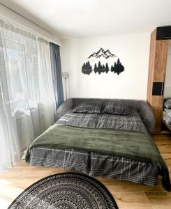 Postel nebo postele na pokoji v ubytování Studio magnifique avec terrasse spacieuse Loèche-les-Bains Vacances