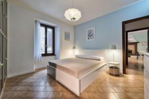 Un pat sau paturi într-o cameră la Nido Antico - Lago + ogni attrazione in 100 mt
