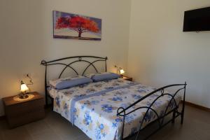 Ένα ή περισσότερα κρεβάτια σε δωμάτιο στο Agriturismo Masseria San Basilio