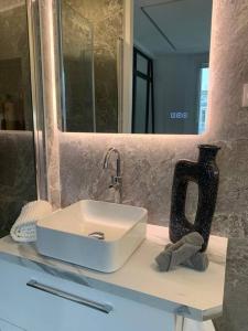 a bathroom counter with a sink and a mirror at Appartement Malesherbes Paris in Paris