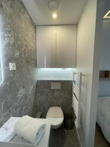 a small bathroom with a toilet and a sink at Appartement Malesherbes Paris in Paris